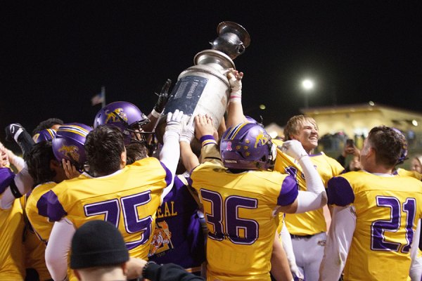 Lemoore High School's 9-1 varsity football team celebrates with The Milkcan after a 42-15 victory over visiting Hanford on Friday night.